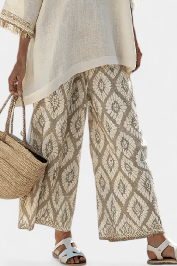 Completo Boho Chic Daisy: Lång Blus och Mönstrade Byxor för en Unik Stil