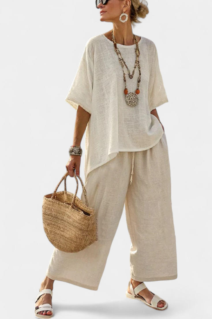 Komplett Minimalistisk Daisy i råa toner med oversized blus och vida byxor för en enkel och elegant stil